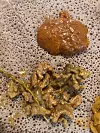 Close-up of Ethiopian stews served on spongy injera flatbread
