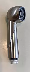 Close-up of a metal faucet sprayer with a long crack along its side.