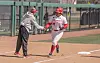 UNM Lobo softball coach Nicole Orgeron high fives sophomore Miracle McKenzie after a home run during a game in the 2026 season.