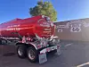 Red Circle K fuel tanker parked near a Route 66 mural on a sunny day