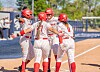 UNM Lobo softball player Ella Dawson's home run celebration with teammates in Reno.
