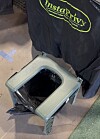 Portable toilet kit with a folding seat and black privacy cover labeled Instaprivy.