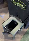 Portable toilet kit with a folding seat and black privacy cover labeled Instaprivy.