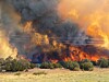 New Mexico wildfires force evacuations, threaten structures