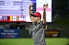 James Keefner waves to fans in the stands from a baseball field.