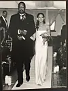 Mel Daniels, left, walks Gayle Brown-Mayes down the aisle on her wedding day.