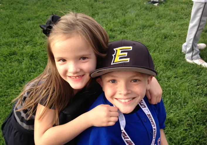 Skye Denton hugs her older brother Austin Denton when the two were young kids in Albuquerque.