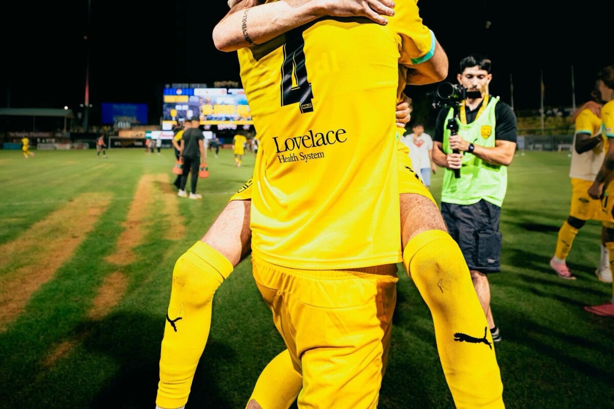 New Mexico United players celebrating a comeback win in 2024