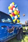 Balloon Fiesta pilot flies west with 94 helium balloons