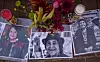Photographs, candles and other items are part of an ofrenda for the late Dolores Huerta set up on the Old Town Plaza in Albuquerque on Wednesday.