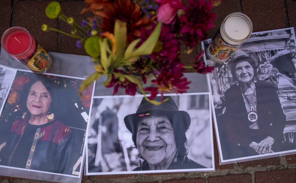 Photographs, candles and other items are part of an ofrenda for the late Dolores Huerta set up on the Old Town Plaza in Albuquerque on Wednesday.